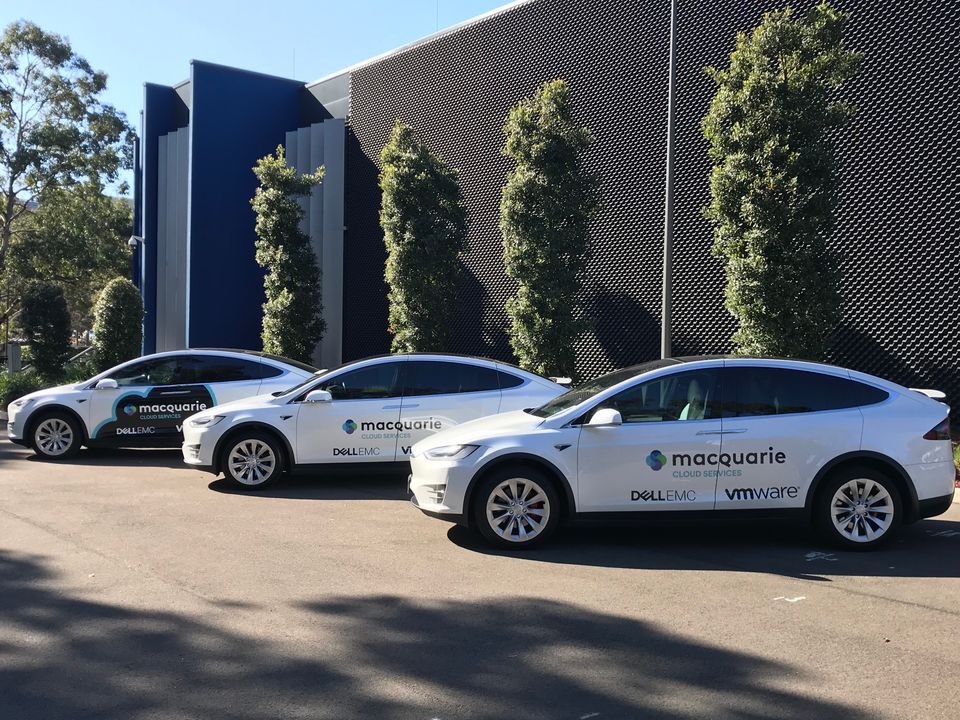 Three Tesla Model X's wrapped in Macquarie Cloud decals.